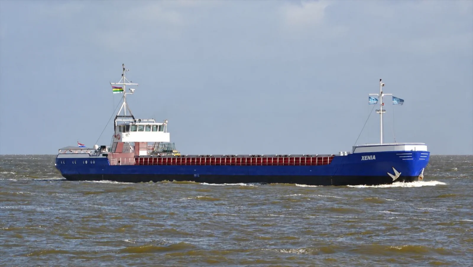Side view of the cargo vessel XENIA on the water